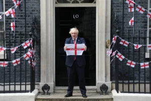 Boris Johnson holds England flag outside Number 10