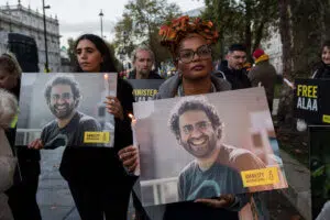 Supporters of the jailed British-Egyptian human rights activist Alaa Abd el-Fattah take part in a candlelight vigil outside Downing Street on November 6 (Anadolu Images)