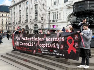“Red Ribbons” rally in Piccadilly Circus calling for the release of Palestinian child detainees